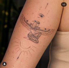 a woman's arm with a tattoo on it that has an airplane flying in the sky