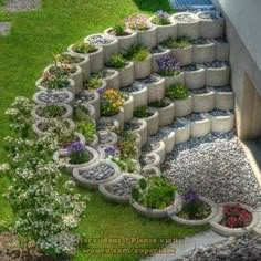 an aerial view of a garden with flowers and rocks