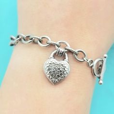 ADORABLE Sterling Silver Marcasite Heart Charm Chain Link Bracelet with Toggle Clasp-Beautifully Crafted.  Made in the 1990s.  This Lovely Bracelet features a Darling, Dangling Heart Charm that features Marcasite Stones that Captures the Light Beautifully.  The Chain Linked Bracelet Itself as well as the Charm is Made from Solid and Stamped Sterling Silver.  The Marcasite Stones measure 1.75mm Round Each The Heart Charm measures 5/8''  The Bracelet measures 8'' in Length Toggle Clasp Weighs 19.7 Heart-shaped Jewelry With Clasp For Gifts, Heart-shaped Jewelry Gift With Clasp, Silver Heart-shaped Bracelet With Toggle Clasp, Silver Heart Bracelet With Toggle Clasp, Silver Heart-shaped Jewelry With Toggle Clasp, Silver Heart Jewelry With Toggle Clasp, Silver Jewelry With Toggle Clasp For Valentine's Day, Linked Bracelet, Charm Chain