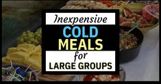 a table topped with lots of different types of food next to a sign that says cold meals for large groups