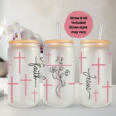 three personalized tumblers with straws on them and flowers in the bottom one