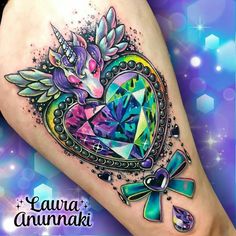 an artistic tattoo design on the leg of a woman's leg with a heart shaped diamond