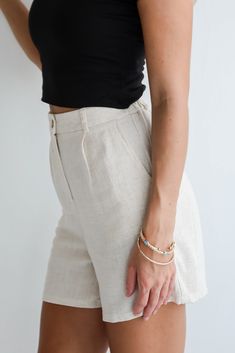 You'll bring an energy that's easy to adore in the Playful Attitude Linen Shorts! These women’s shorts are crafted from soft, breathable linen, offering unmatched comfort and a chic, relaxed fit. The light and airy fabric keeps you cool and comfortable, making them ideal for warm weather and sunny days. Designed with a high-waisted fit, these shorts flatter your silhouette while providing a comfortable, adjustable waistband with a stylish tie detail. Pair these shorts with a crisp blouse and san Trendy Linen Shorts For Day Out, Neutral Linen Shorts For Spring, Trendy Linen Shorts For Summer, Beige Shorts For Everyday Spring Wear, Spring Neutral Linen Shorts, Everyday Beige Shorts For Spring, Neutral Linen Shorts For Summer, Chic Linen Shorts For Day Out, Everyday Linen Shorts For Spring