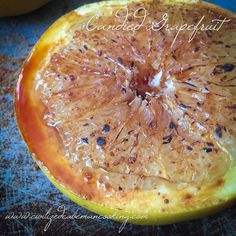 an orange cut in half sitting on top of a table