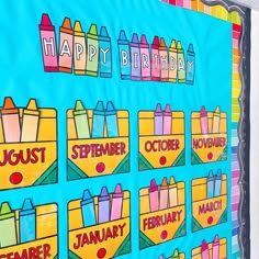 a bulletin board with crayons on it and the words happy birthday written in different colors