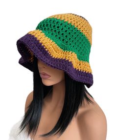 a crocheted hat is on top of a mannequin's head