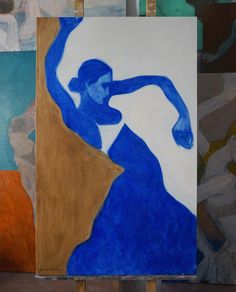 an abstract painting of a woman in blue is on easel next to other paintings