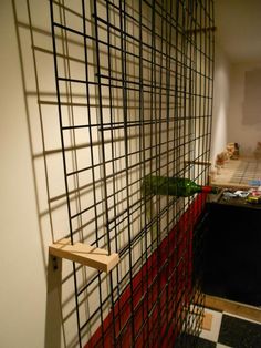 a room with a wall made out of metal bars