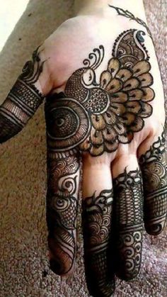 henna tattoo on the palm of someone's hand