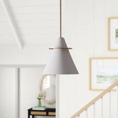 a light fixture hanging from the ceiling in a living room