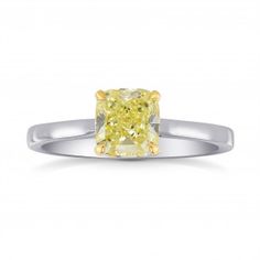 a yellow diamond ring on a white background