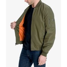 This classic bomber jacket from Michael Kors is perfect for stylish Instagrammers. Featuring a water-resistant shell and zip closure, it keeps you dry without compromising looks. Subtle touches like ribbed collar, snap pockets and signature logo badge complete the authentic aviator style. With cozy knit cuffs and waist trim, you'll want to lounge and lounge in its versatile charcoal or navy hue all season long. Casual Michael Kors Outerwear For Fall, Casual Michael Kors Outerwear With Pockets, Military Jacket Men, Luxury Michael Kors Men's Outerwear, Luxury Men's Single-breasted Utility Jacket, Michael Kors Men, Logo Badge, Aviator Style, Cozy Knit