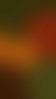 a blurry image of an orange and green background