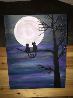 two cats sitting on a tree branch in front of a full moon painted on canvas