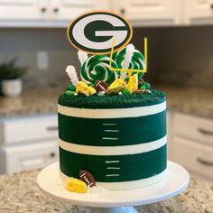 a green bay packers cake on a kitchen counter