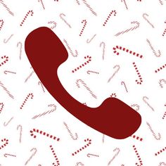 a red phone sitting on top of a white background with candy canes all over it