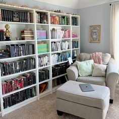 a living room filled with lots of books