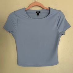 Women's Express Dusk Blue Body Contour Matte 90's Cropped Tee. Crew Neck. Short Sleeves. Double Layer Of Fabric In Front And Back. Straight Hem. Cropped Length. Brand New With Tags Size: Small Basic Blue Fitted Top, Blue Basic Fitted Top, Basic Fitted Blue Top, Blue Fitted Basic Tops, Trendy Fitted Blue Crop Top, Blue Fitted Short Sleeve Top With Crew Neck, Blue Fitted Crew Neck Short Sleeve Top, Fitted Blue Basic Tops, Fitted Blue Crew Neck Short Sleeve Top