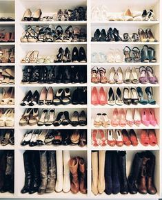 there are many pairs of shoes in the closet