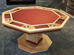 a wooden table with red cloth on top