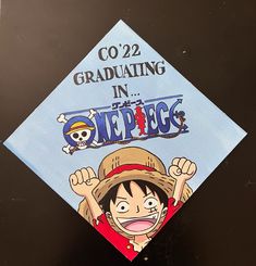 a graduation cap with an image of a boy wearing a hat and holding his hands up in the air