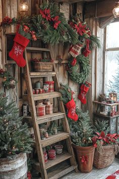 a ladder decorated with christmas stockings and decorations