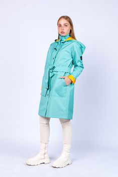 "Women Aquamarine color Fashion Unique Raincoat with belt \"HONDURAS\" 533 Handmade in Lithuania.  Enjoy functional and stylish raincoat. This raincoat is waterproof and wind-resistant to keep you warm and dry. Raincoat is with a hood and has big pockets. Belt included. You can wear it without a belt, or if you want a more elegant look with a belt. The fabric is covered with PU. Color: Bright Aquamarine Material: 100% Polyester, covered with PU. Lining: 100% Rayon, yellow color Size: XS, S, M, L, XL, XXL Precise raincoat size (cm/inch) You can find in photos area." Green Weatherproof Raincoat For Spring, Green Raincoat For Winter Workwear, Green Winter Raincoat For Work, Green Winter Raincoat For Workwear, Spring Green Waterproof Parka, Green Spring Raincoat With Detachable Hood, Green Raincoat With Detachable Hood For Spring, Spring Green Raincoat With Detachable Hood, Blue Weatherproof Raincoat For Rainy Season