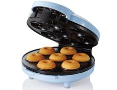 an electric waffle maker with twelve muffins in it