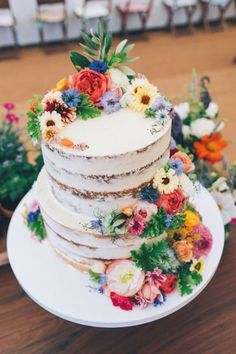 there is a white cake with flowers on it