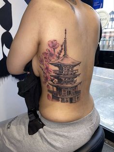 a woman with a tattoo on her back