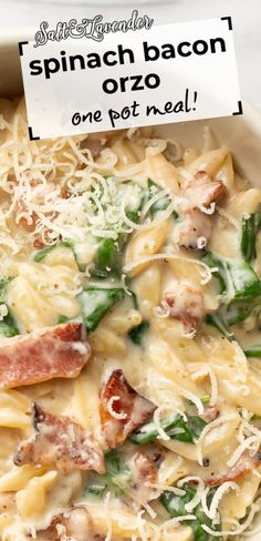 a bowl filled with pasta and bacon on top of a white tablecloth next to a sign that reads spinach bacon orzo one pot meal