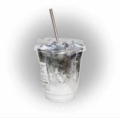 an ice cold drink in a plastic cup with a metal straw sticking out of it