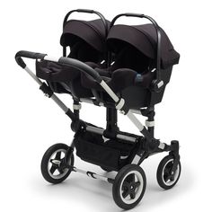 two baby strollers with black seats and wheels