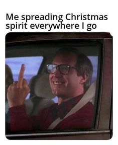 a man in glasses pointing to the tv screen that says, me spreading christmas spirit everywhere i go