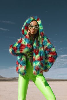 Add a burst of color to your festival wardrobe with our Multicolor Neon Faux Fur Hooded Festival Jacket. This vibrant jacket features a blend of neon colors that will make you stand out in any crowd. The cozy hood and soft faux fur provide warmth and comfort, perfect for those chilly festival nights. Whether you're at Burning Man, Coachella, or any rave event, this jacket is designed to turn heads and make a bold fashion statement. Pair it with your favorite festival outfits for an unforgettable look. Key Features: *Vibrant multicolor neon design *Soft and luxurious faux fur *Cozy hood for added warmth and style *Perfect for festivals, raves, and other events *High-quality materials for comfort and durability Fabric & Care: *Made from high-quality faux fur *Hand wash cold, line dry *Do not Trendy Multicolor Festival Outerwear, Trendy Multicolor Outerwear For Festivals, Trendy Winter Festival Outerwear, Fall Rave Outerwear With Long Sleeves, Rave Long Sleeve Outerwear For Fall, Fall Rave Long Sleeve Outerwear, Funky Multicolor Winter Outerwear, Funky Long Sleeve Winter Outerwear, Trendy Multicolor Hooded Outerwear