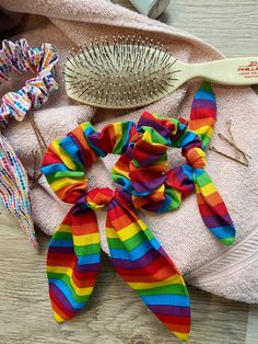 Elevate your hair game with our Stripe Rainbow Scrunchies, a vibrant accessory that adds a pop of color and a sense of pride to your day. This LGBTQAI+ Pride Hair Elastic features a striking rainbow striped design, perfect for showcasing your pride and love for vibrant colors. Whether you prefer a short or long bow, this elastic offers a stylish and practical way to pull back your hair. It's a must-have for rainbow lovers, individuals with long hair, and anyone who adores bright and colorful acc Rainbow Scrunchies, Scrunchies With Bow, Pride Hair, Long Hair Girls, Rainbow Accessories, Long Bow, Rainbow Keychain, Hair Girls, Hair Elastic