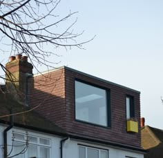 the roof of a house with two windows