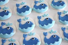 blue and white decorated cupcakes with fish on them