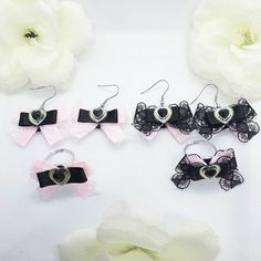 This listing is for our handmade  satin and lace bow rings and earrings ,earrings comes as a pair. Made from high quality satin ribbon and heart centrepiece. Has a ajustable ring easy to wear. Designed and embelished to complete the kawaii look!  Please your item/s from drop down menu.  Please allow 3-5 days for item to be made before dispatching.  Free UK  standard delivery available (3-5 working days). Please select a paid service for faster delivery service.  All international orders are sent tracked and signed (10 working days).  Any questions please do get in touch.  Custom orders are open,  if you are looking at design and need it in a different colour or maybe your own original design. Please get in touch to discuss your idea.  Thank you 💞🎀 Silver Harajuku Jewelry For Party, Silver Harajuku Style Party Jewelry, Cute Black Jewelry For Party, Party Jewelry In Silver With Black Ribbon, Silver Jewelry With Black Ribbon For Parties, Black Bow Jewelry Gift, Black Bow Jewelry For Gifts, Black Bow Jewelry For Gift, Cute Bow Jewelry For Valentine's Day