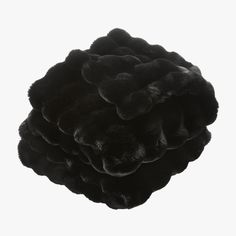 a black object that looks like it is made out of fake fur and has been placed on