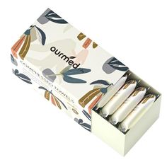 an open box of bamboo toothbrushes on a white background