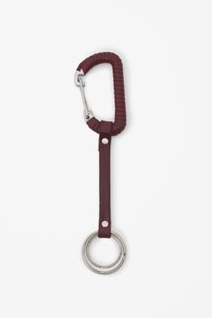 a key chain with a ring on top of it and a hook in the middle