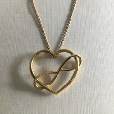 Movado 18k Gold Large Infinity Heart Pendant And 18" 14k Gold Chain. Please Note That The Pendant Is 18k And The Chain Is 14k. The Chain Is Unmarked So I Cannot Confirm Whether Or Not It Is A Movado Chain. Will Sell Just The Pendant For $500. Heart Pendant Measures Approx. 38mm X 31mm. Total Necklace (Pendant + Chain) Weighs 13.25g. Infinity Heart, Gold Chains, Heart Pendant, Womens Jewelry Necklace, 18k Gold, Jewelry Necklaces, Women Jewelry, Pendant Necklace, Chain