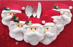 a christmas place mat with santa clauss and silverware on it, next to a fork and knife