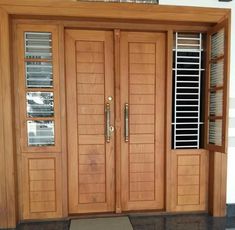 two wooden doors with glass panes on each side