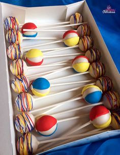 there are many colorful lollipops in the box