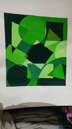 a piece of paper with green shapes on it