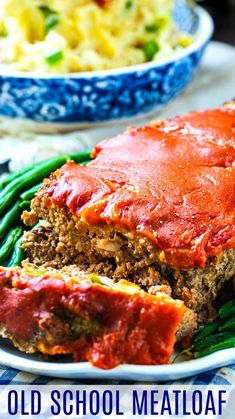 an old school meatloaf with green beans and mashed potatoes on the side