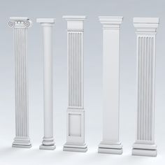 four white pillars are lined up against a gray background