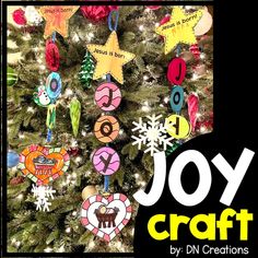 a christmas tree with ornaments hanging from it's branches and the words joy craft